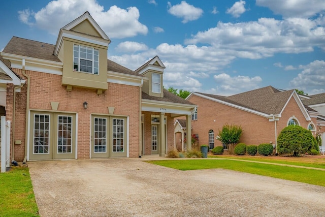 6706 Willow Trace Dr, Chattanooga, TN 37421 - view of front facade with brick siding, a patio, and a front yard