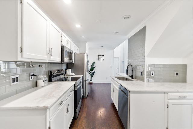 6706 Willow Trace Dr, Chattanooga, TN 37421 - kitchen featuring a sink, stainless steel appliances, decorative backsplash, white cabinetry, and baseboards