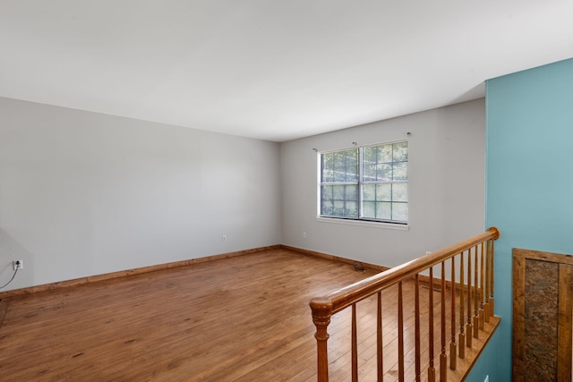 empty room with hardwood / wood-style flooring