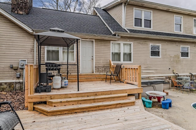 wooden deck featuring a gazebo