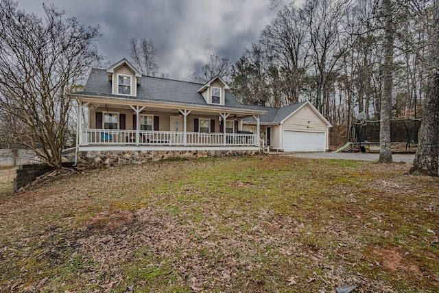 view of front of home with covered porch and an attached garage