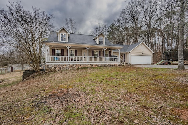 view of front of house featuring a garage and a porch