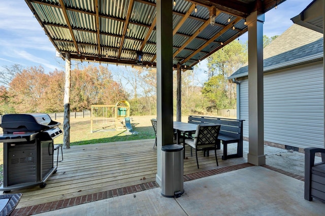 view of patio / terrace with a grill and a playground