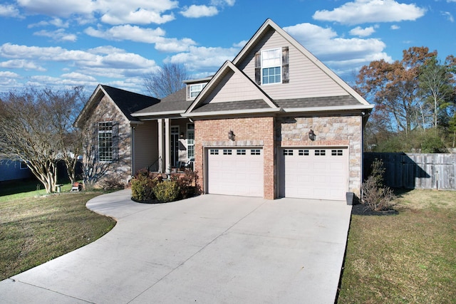 view of front of property with a front yard and a garage