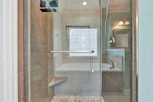 bathroom with separate shower and tub