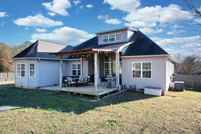 back of property featuring central AC, a yard, and a deck