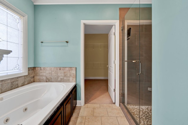 bathroom featuring tile patterned flooring and independent shower and bath