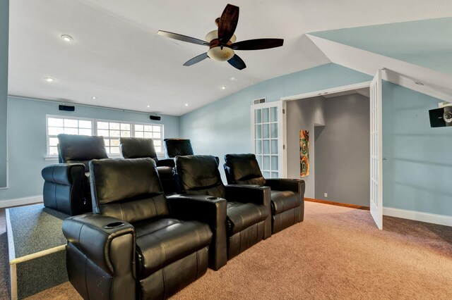 home theater room with carpet, ceiling fan, and lofted ceiling