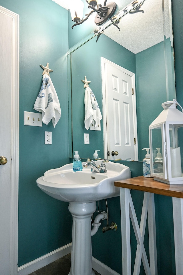 bathroom with an inviting chandelier