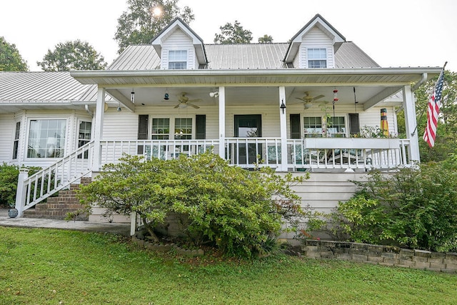 rear view of property with ceiling fan, covered porch, and a yard