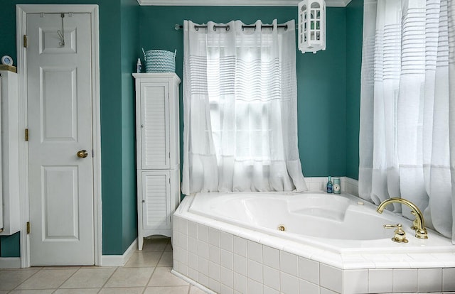 bathroom featuring tile patterned flooring and a relaxing tiled tub