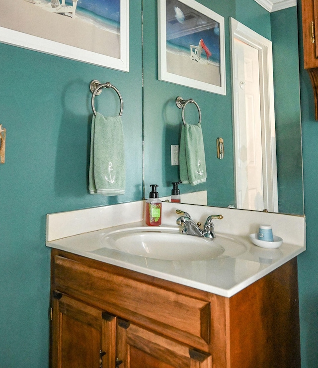 bathroom featuring vanity and ornamental molding