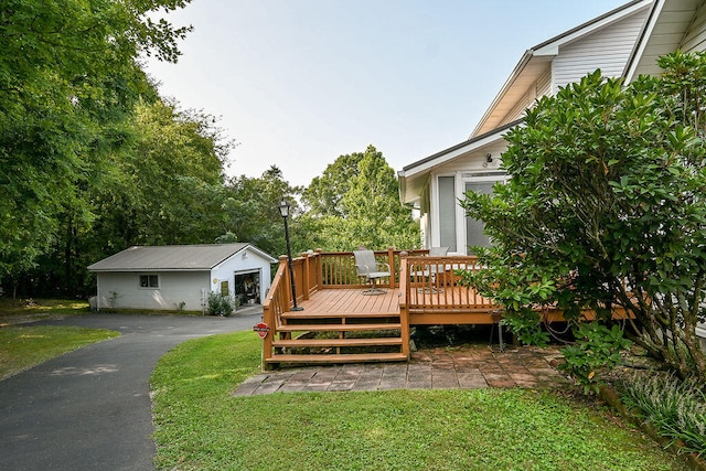 wooden deck featuring a lawn