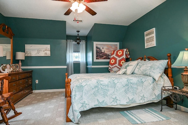 bedroom with carpet flooring, ceiling fan, and lofted ceiling