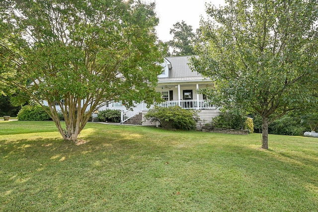 view of front of house with a front lawn and a porch