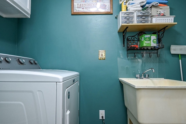 laundry room featuring cabinets and sink