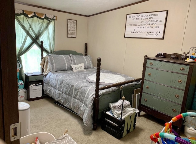 carpeted bedroom featuring a textured ceiling and ornamental molding