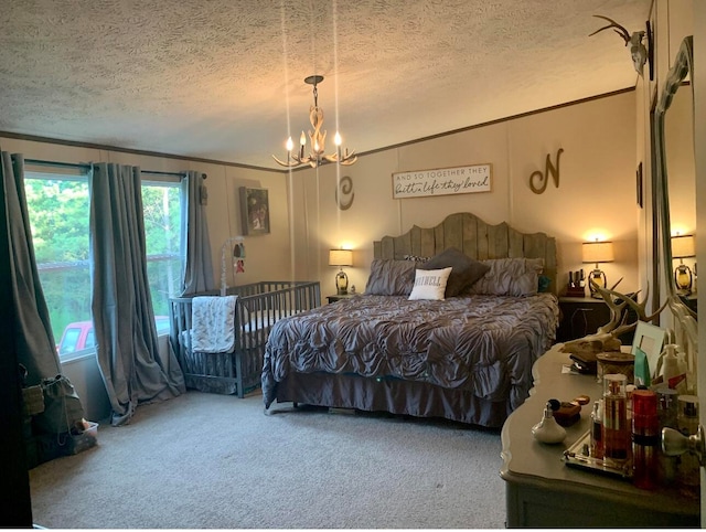 carpeted bedroom featuring a textured ceiling and a notable chandelier