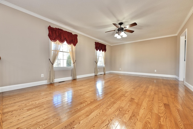 unfurnished room featuring ornamental molding, ceiling fan, and light wood-type flooring