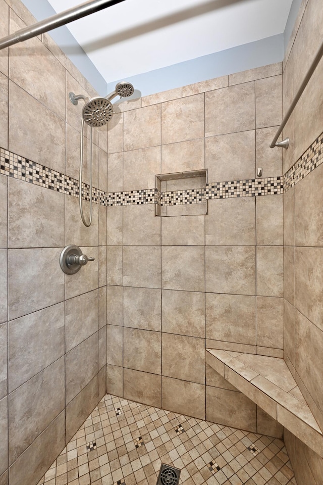 bathroom with tiled shower