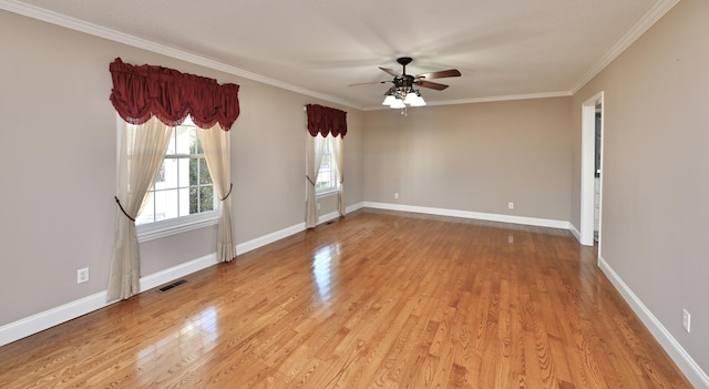 spare room with crown molding, ceiling fan, and light wood-type flooring