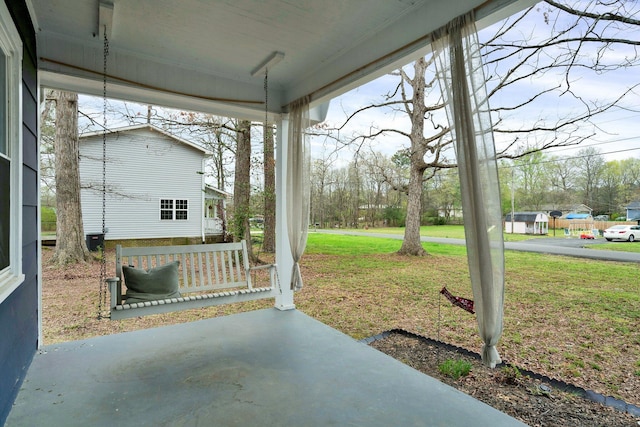 view of patio featuring a porch