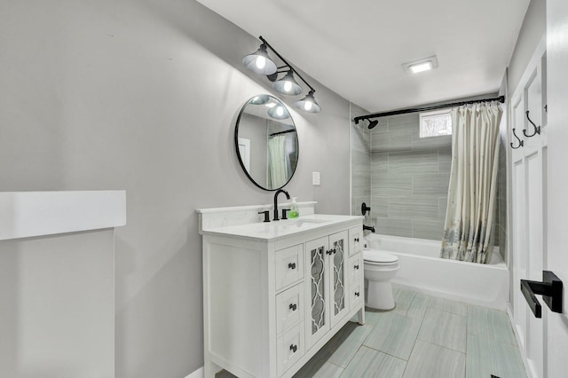 bathroom featuring toilet, shower / bath combo, and vanity