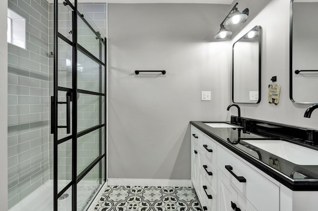 full bath featuring tile patterned floors, a sink, and tiled shower