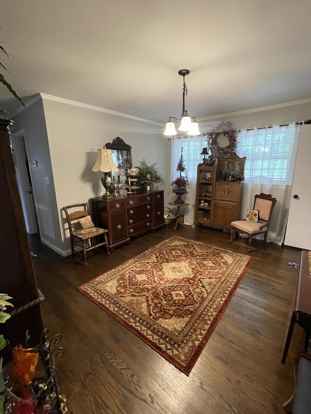 4010 Elm Ln NE, Cleveland, TN 37312 - living area with ornamental molding, wood finished floors, a chandelier, and baseboards