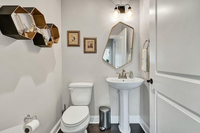 bathroom featuring toilet and sink