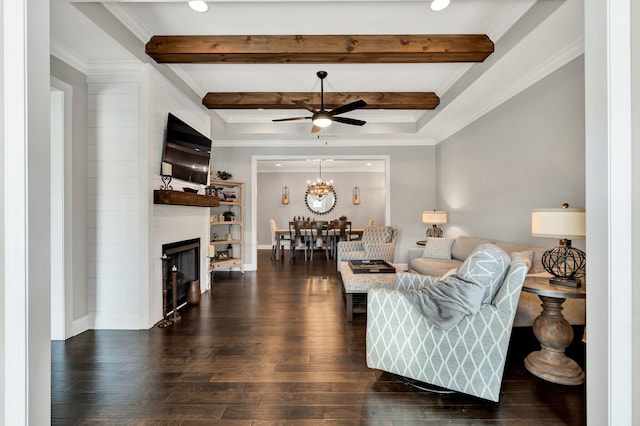 living room with dark hardwood / wood-style floors, ceiling fan, and crown molding