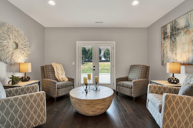 living area with french doors and dark wood-type flooring