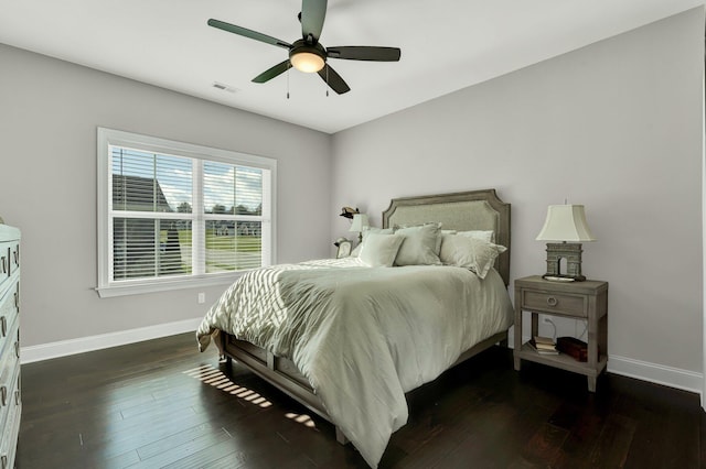 bedroom featuring ceiling fan and dark wood-type flooring