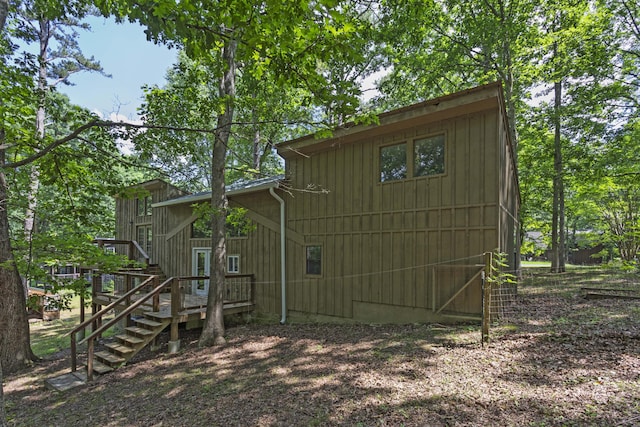 34 Miller Cove Cir, Signal Mountain, TN 37377 - rear view of house featuring stairs, a wooden deck, and board and batten siding