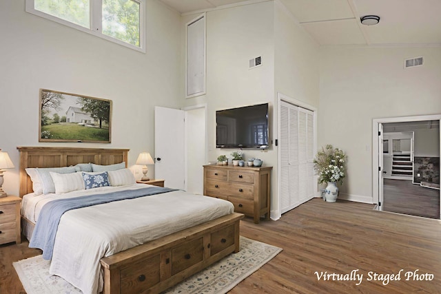 34 Miller Cove Cir, Signal Mountain, TN 37377 - bedroom featuring a towering ceiling and wood finished floors