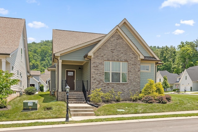 9614 Mulberry Gap Way, Ooltewah, TN 37363 - view of front of property featuring brick siding, a front yard, and a shingled roof