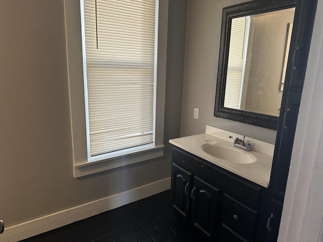 bathroom featuring vanity and baseboards