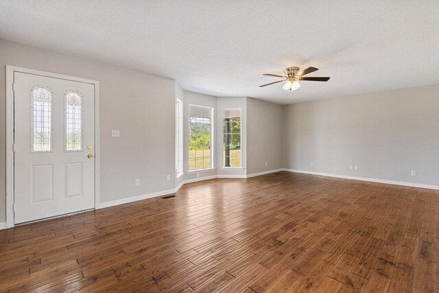 373 Kile Ln SW, Cleveland, TN 37311 - entrance foyer featuring a ceiling fan, dark wood finished floors, baseboards, and a textured ceiling