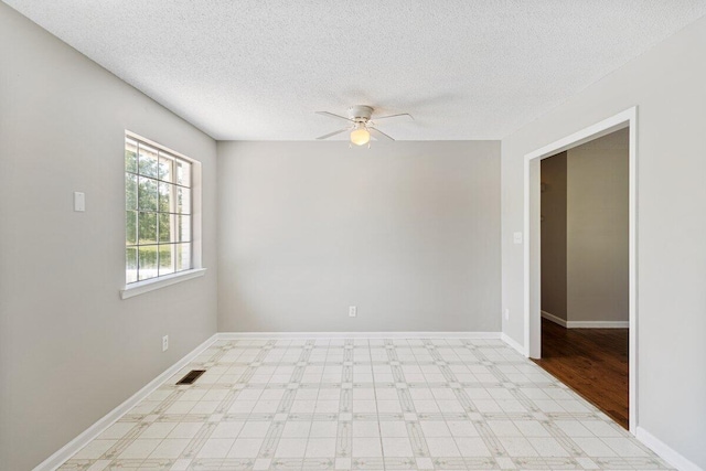 373 Kile Ln SW, Cleveland, TN 37311 - unfurnished room featuring ceiling fan, light flooring, a textured ceiling, and baseboards