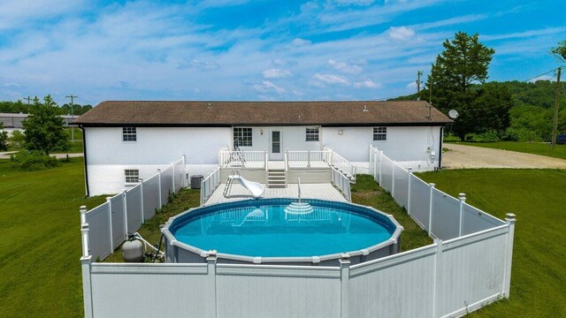 373 Kile Ln SW, Cleveland, TN 37311 - rear view of house with a wooden deck and central AC unit