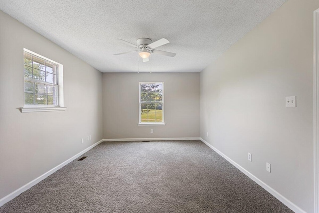 373 Kile Ln SW, Cleveland, TN 37311 - carpeted spare room with a ceiling fan, a textured ceiling, and baseboards