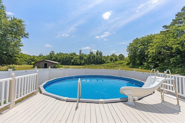 373 Kile Ln SW, Cleveland, TN 37311 - view of pool featuring a wooden deck, a water slide, and view of scattered trees