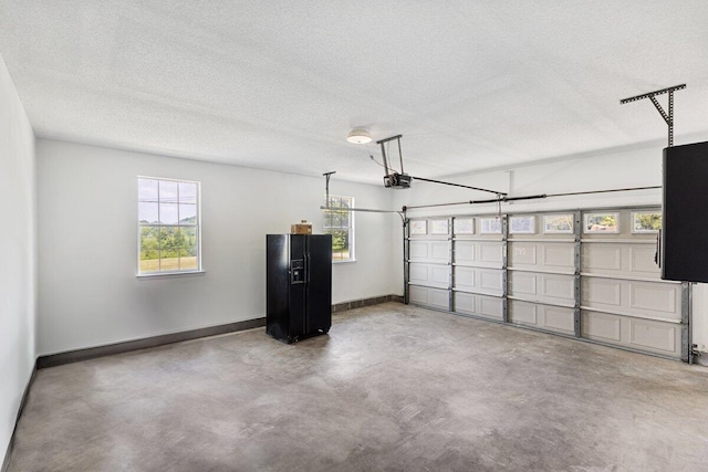 373 Kile Ln SW, Cleveland, TN 37311 - garage featuring a garage door opener and baseboards