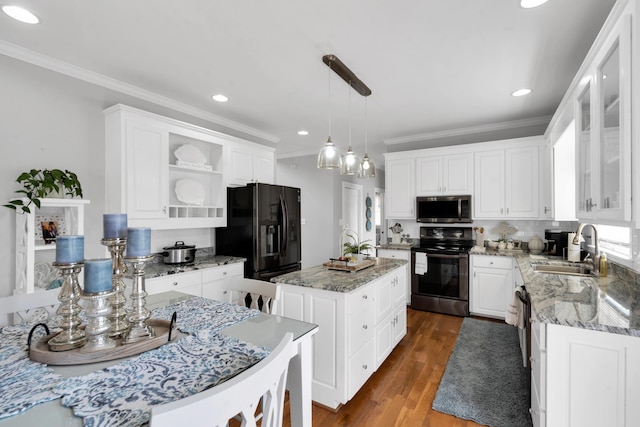 kitchen featuring dark wood-style floors, open shelves, a kitchen island, a sink, and black appliances