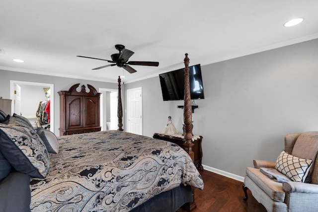 bedroom with crown molding, recessed lighting, a closet, wood finished floors, and baseboards