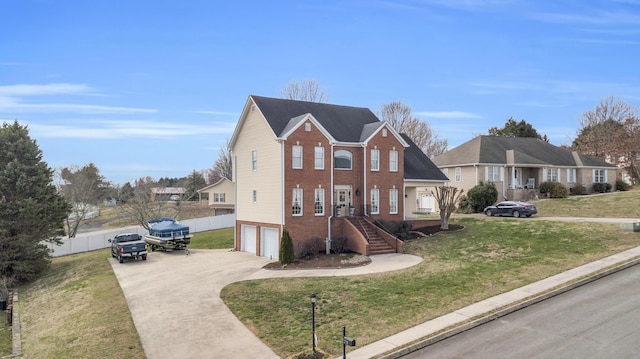 view of front of home featuring a garage, brick siding, fence, driveway, and a front yard