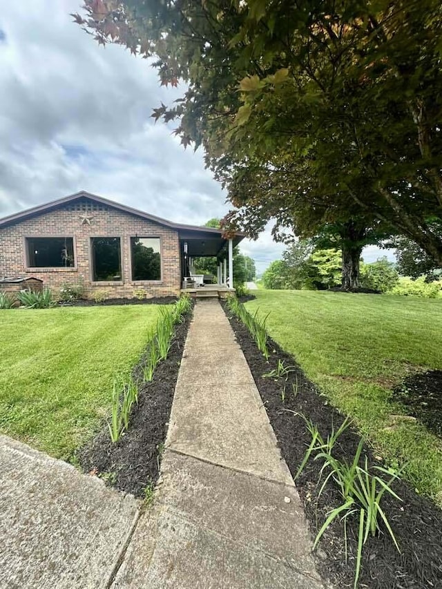 2996 Sugar Grove Valley Rd, Harriman, TN 37748 - view of front of home with a front lawn and brick siding