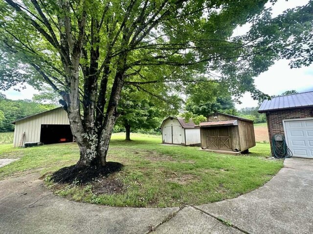 2996 Sugar Grove Valley Rd, Harriman, TN 37748 - view of grassy yard featuring an outbuilding and a shed