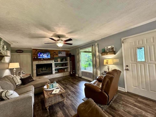 2996 Sugar Grove Valley Rd, Harriman, TN 37748 - living room featuring ornamental molding, a textured ceiling, a ceiling fan, wood finished floors, and a fireplace with raised hearth