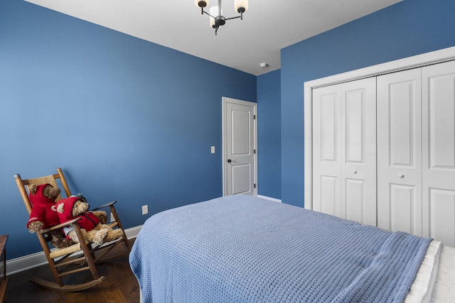 bedroom featuring a closet and dark hardwood / wood-style floors